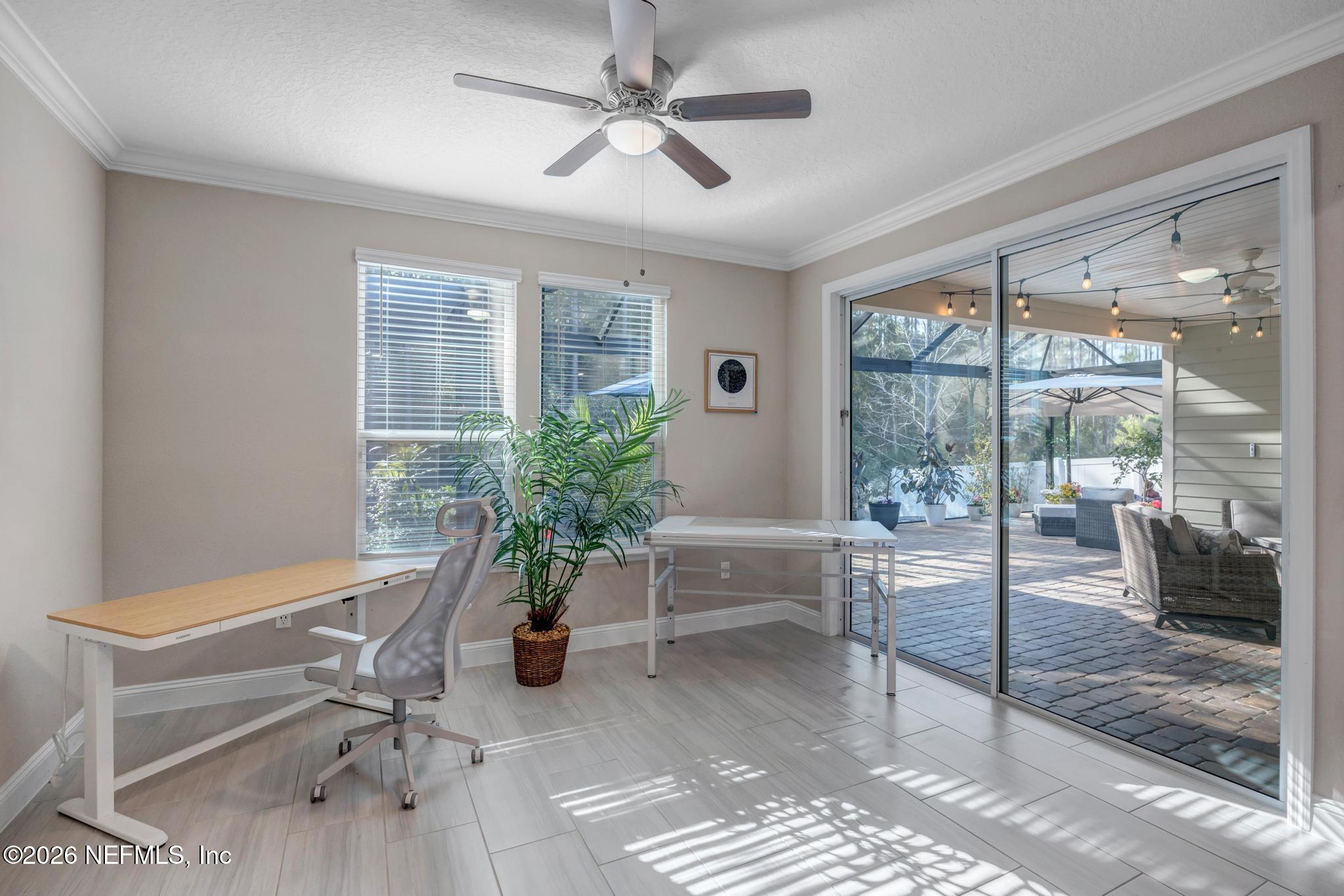 196 Silver Reef Lane St. Augustine, FL 32095 - Photo 22 of 62 a living room with furniture and a potted plant