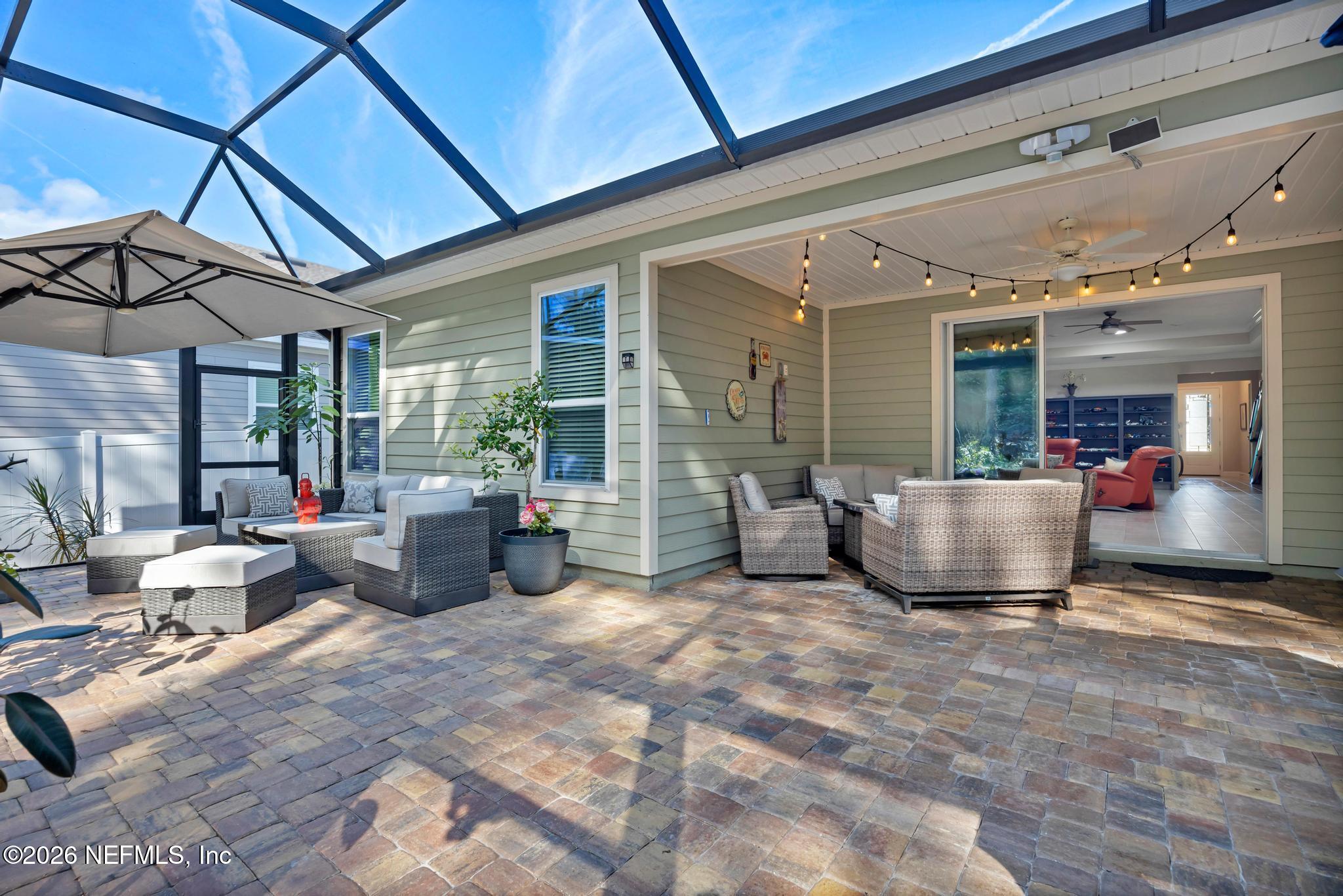 196 Silver Reef Lane St. Augustine, FL 32095 - Photo 35 of 62 a view of a chairs and tables in patio