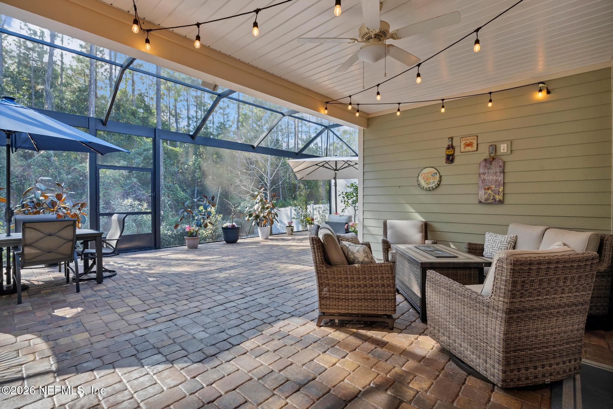 196 Silver Reef Lane St. Augustine, FL 32095 - Photo 36 of 62 a view of a patio with table and chairs