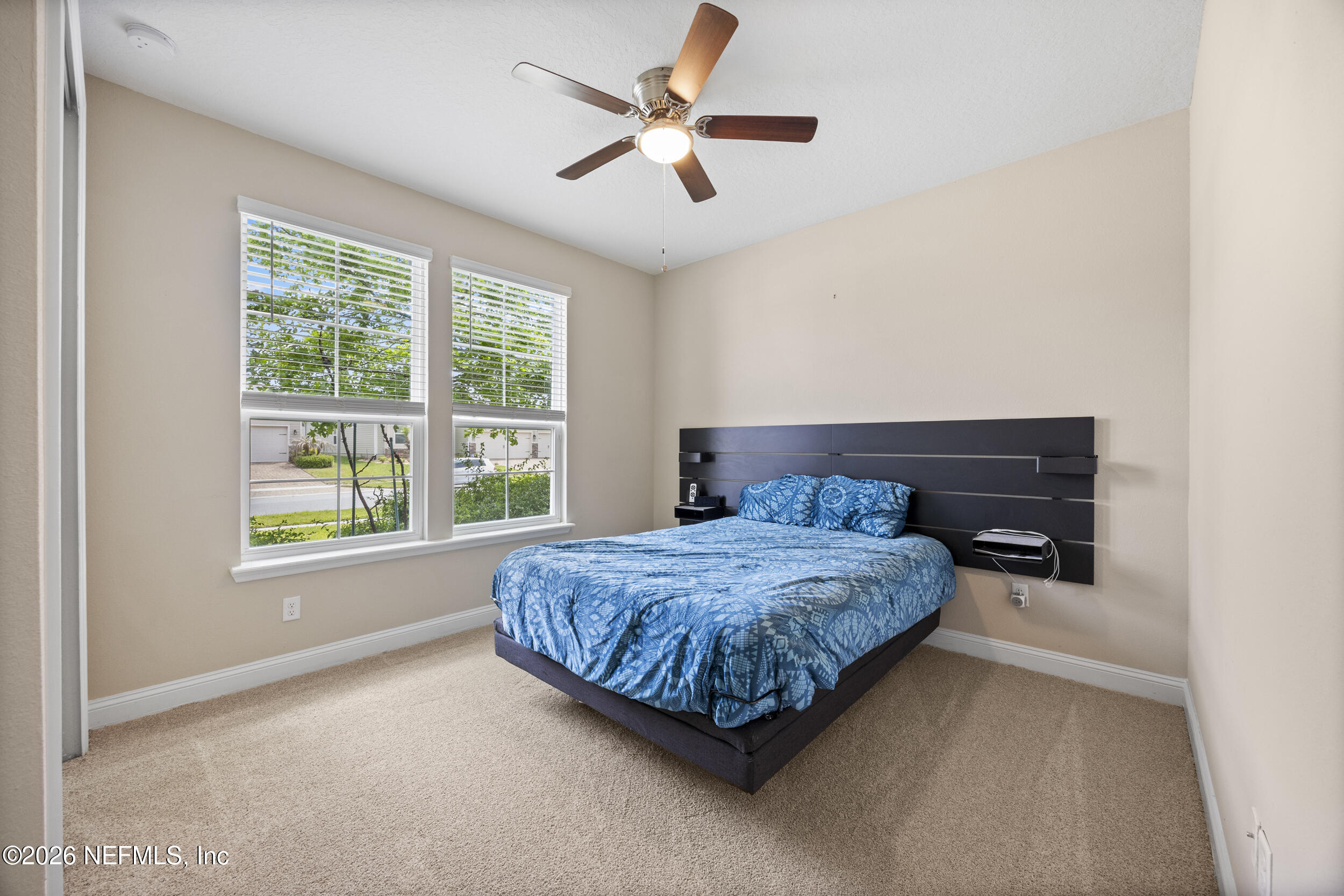 196 Silver Reef Lane St. Augustine, FL 32095 - Photo 8 of 62 a bedroom with a bed and window