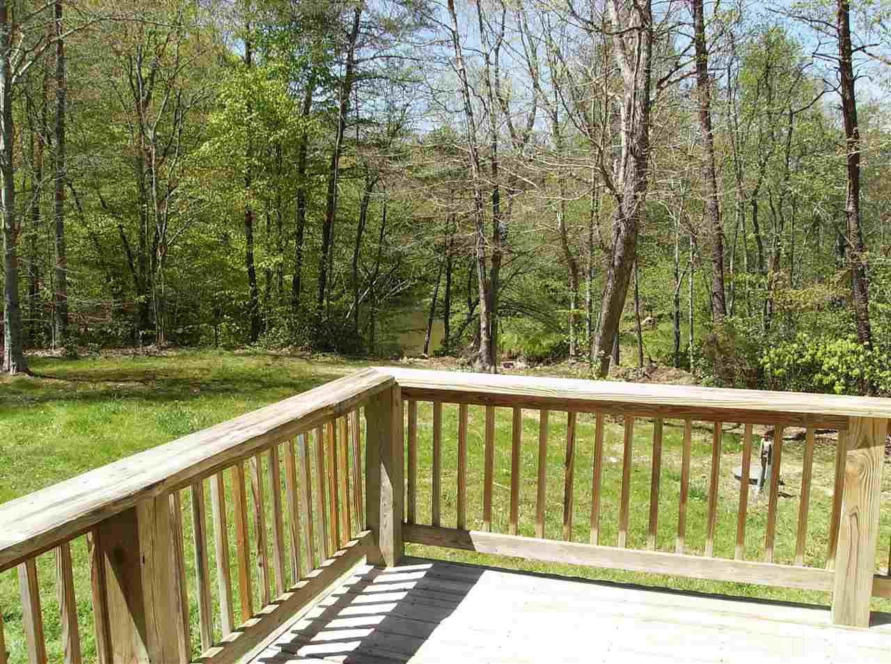 1077 Harris Mill Road Rougemont, NC 27572 - Photo 1 of 9 a view of balcony with yard