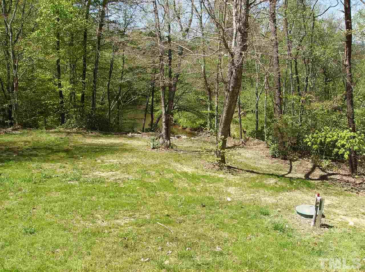 1077 Harris Mill Road Rougemont, NC 27572 - Photo 2 of 9 a view of a yard with swimming pool