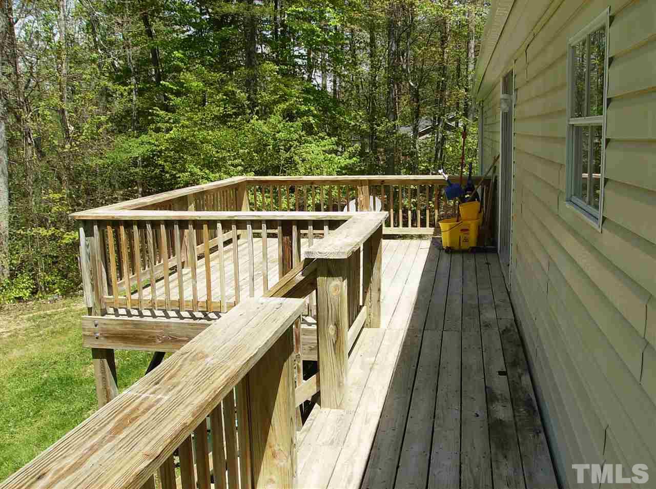 1077 Harris Mill Road Rougemont, NC 27572 - Photo 8 of 9 a view of balcony with wooden floor and fence