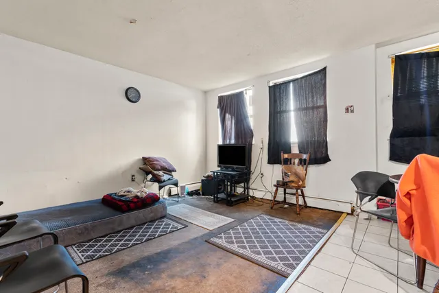 a living room with furniture and a rug