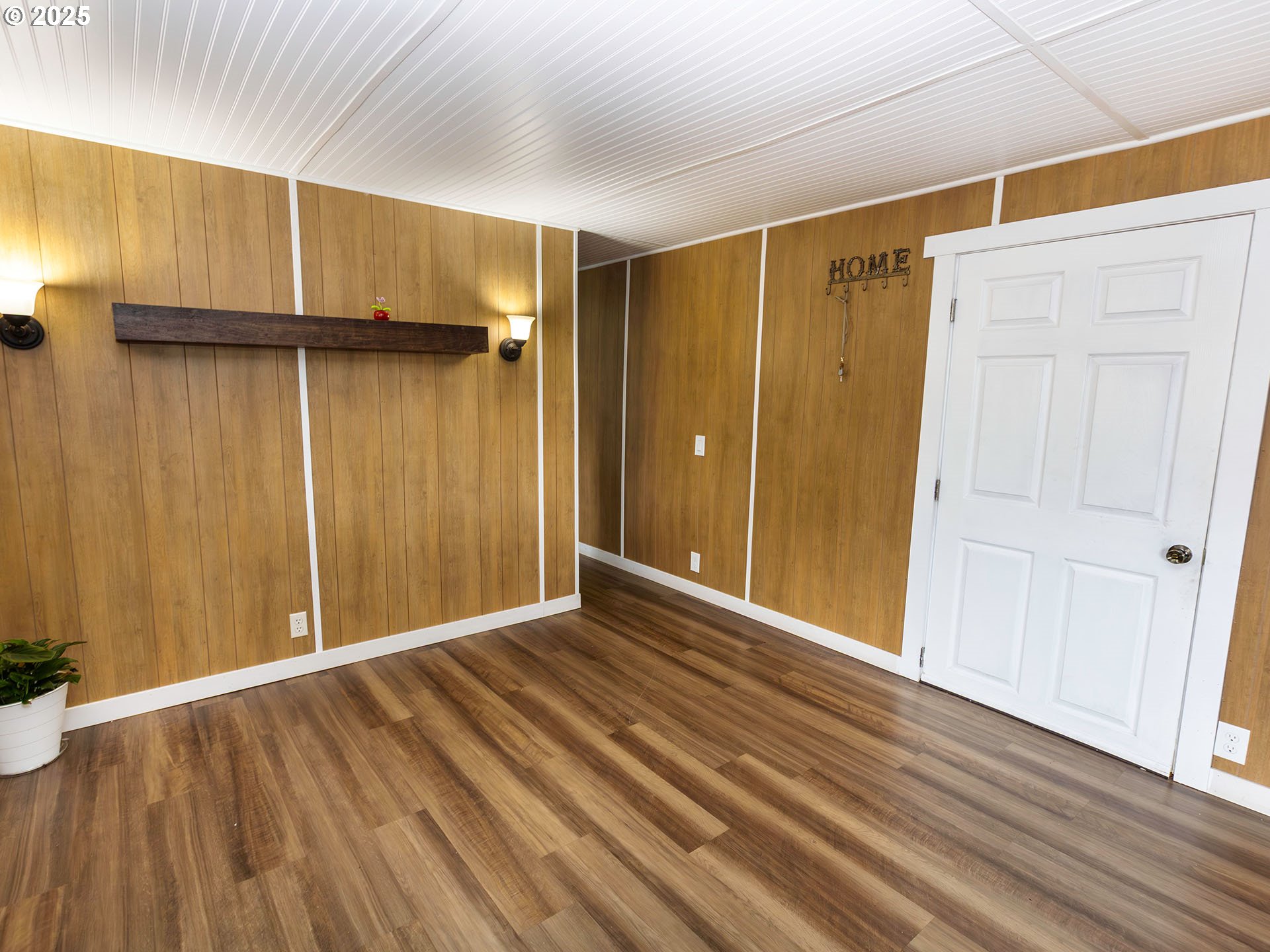 10701 Southeast Highway 212, Unit 13 Clackamas, OR 97015 - Photo 11 of 26 a view of a room with wooden floor