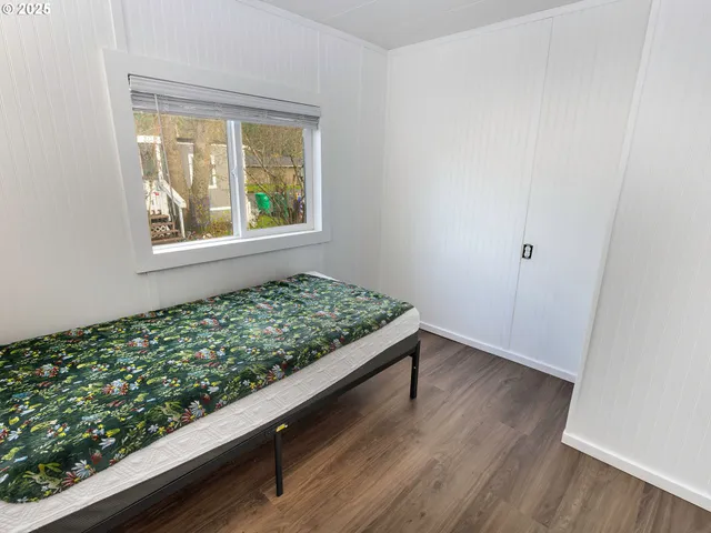 a view of wooden floor and a window