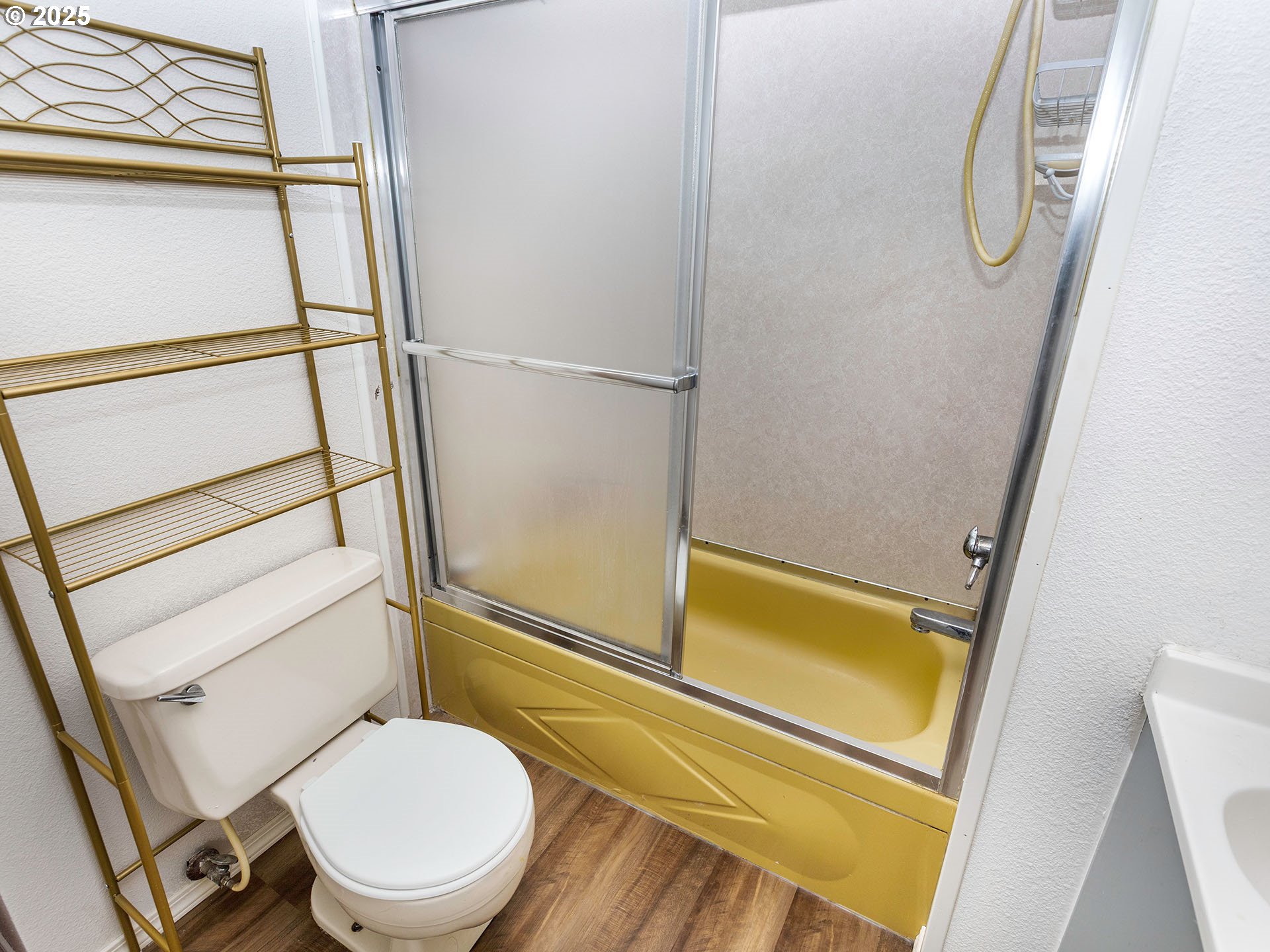 10701 Southeast Highway 212, Unit 13 Clackamas, OR 97015 - Photo 18 of 26 a bathroom with a toilet and a shower