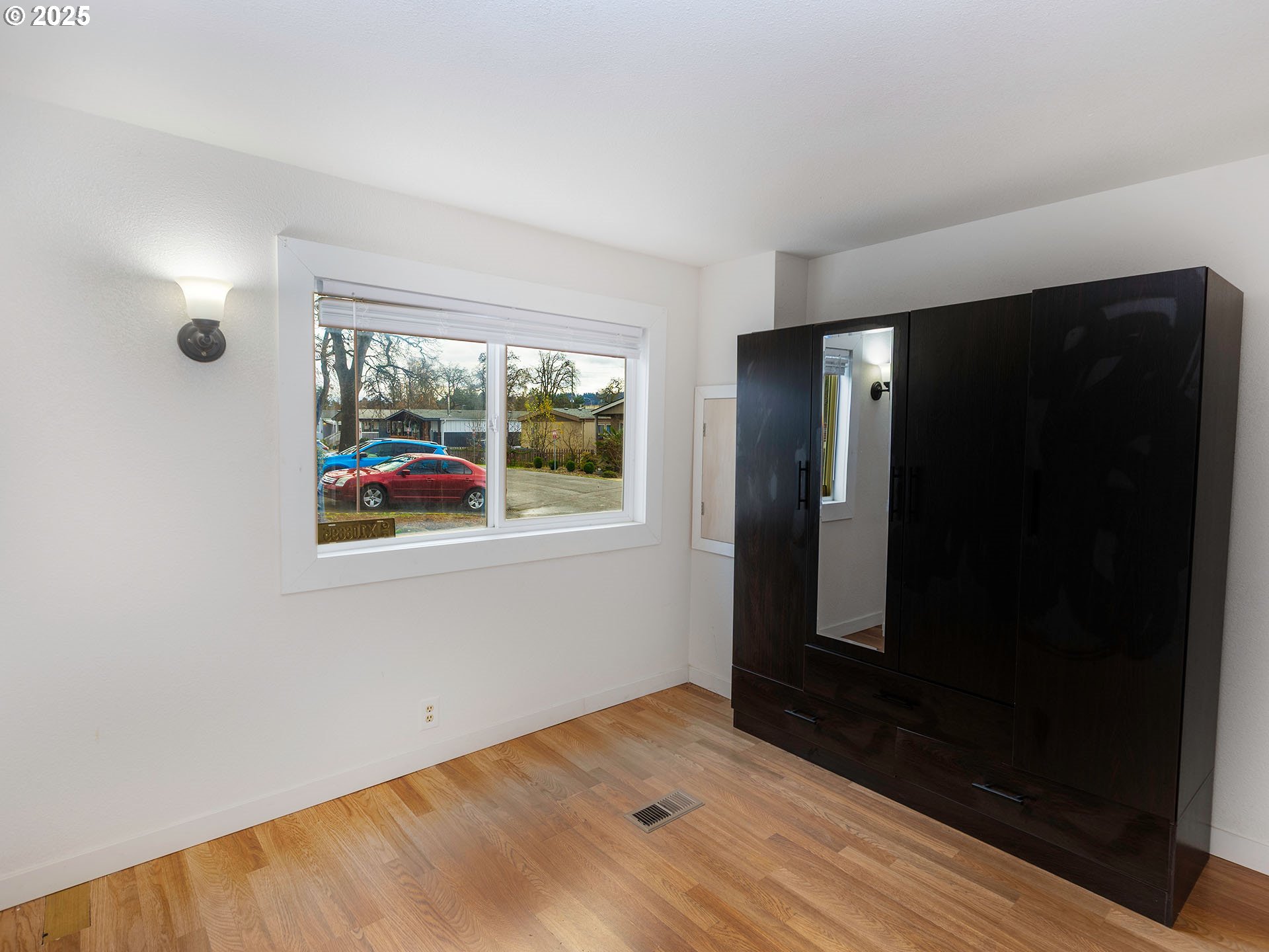 10701 Southeast Highway 212, Unit 13 Clackamas, OR 97015 - Photo 20 of 26 wooden floor in an empty room