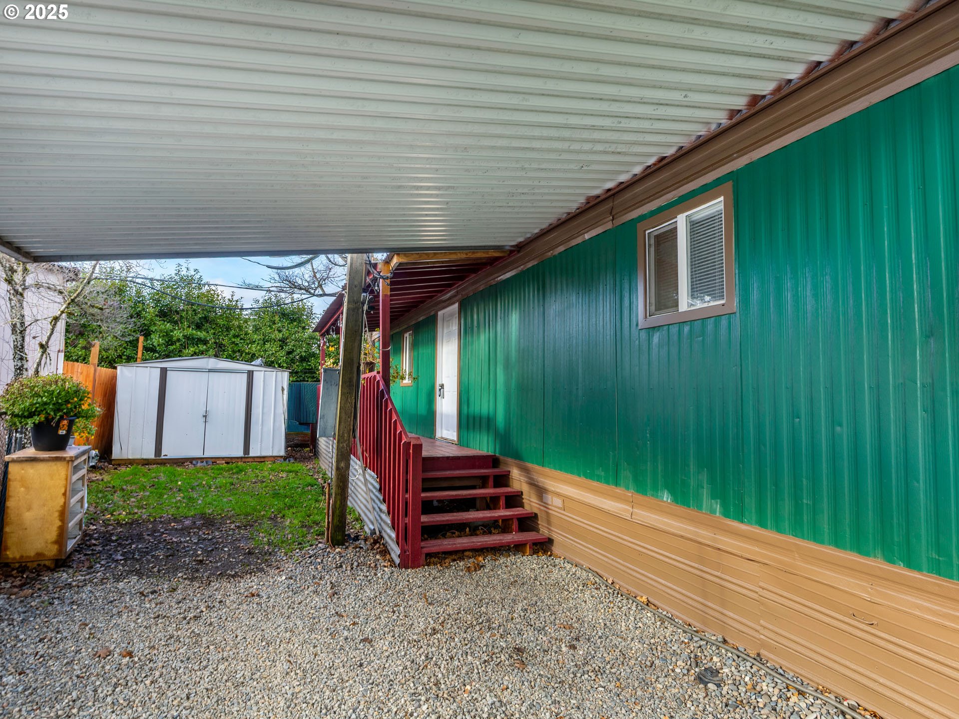 10701 Southeast Highway 212, Unit 13 Clackamas, OR 97015 - Photo 2 of 26 a backyard of a house with seating space