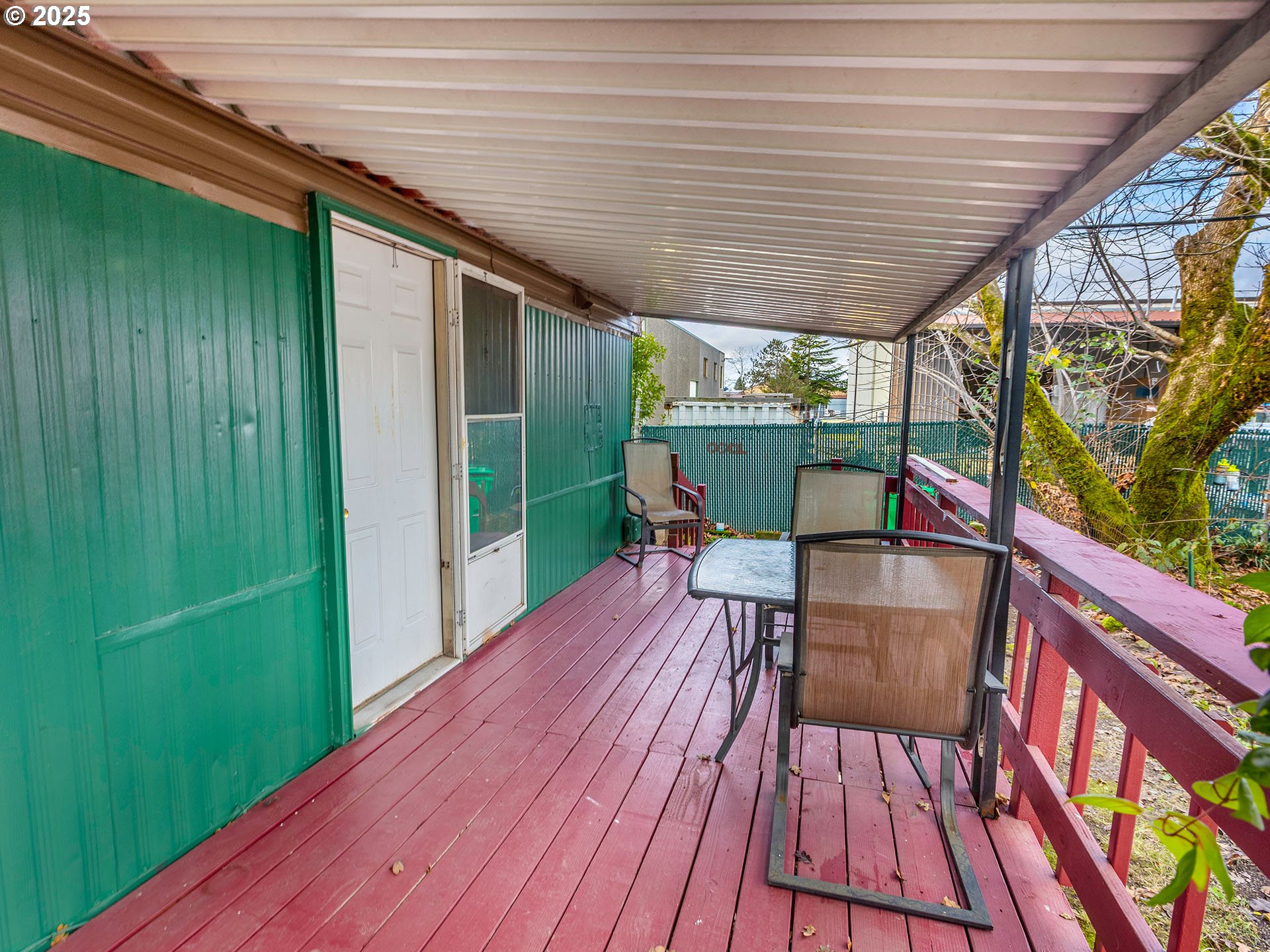 10701 Southeast Highway 212, Unit 13 Clackamas, OR 97015 - Photo 22 of 26 a patio with wooden floor and outdoor seating