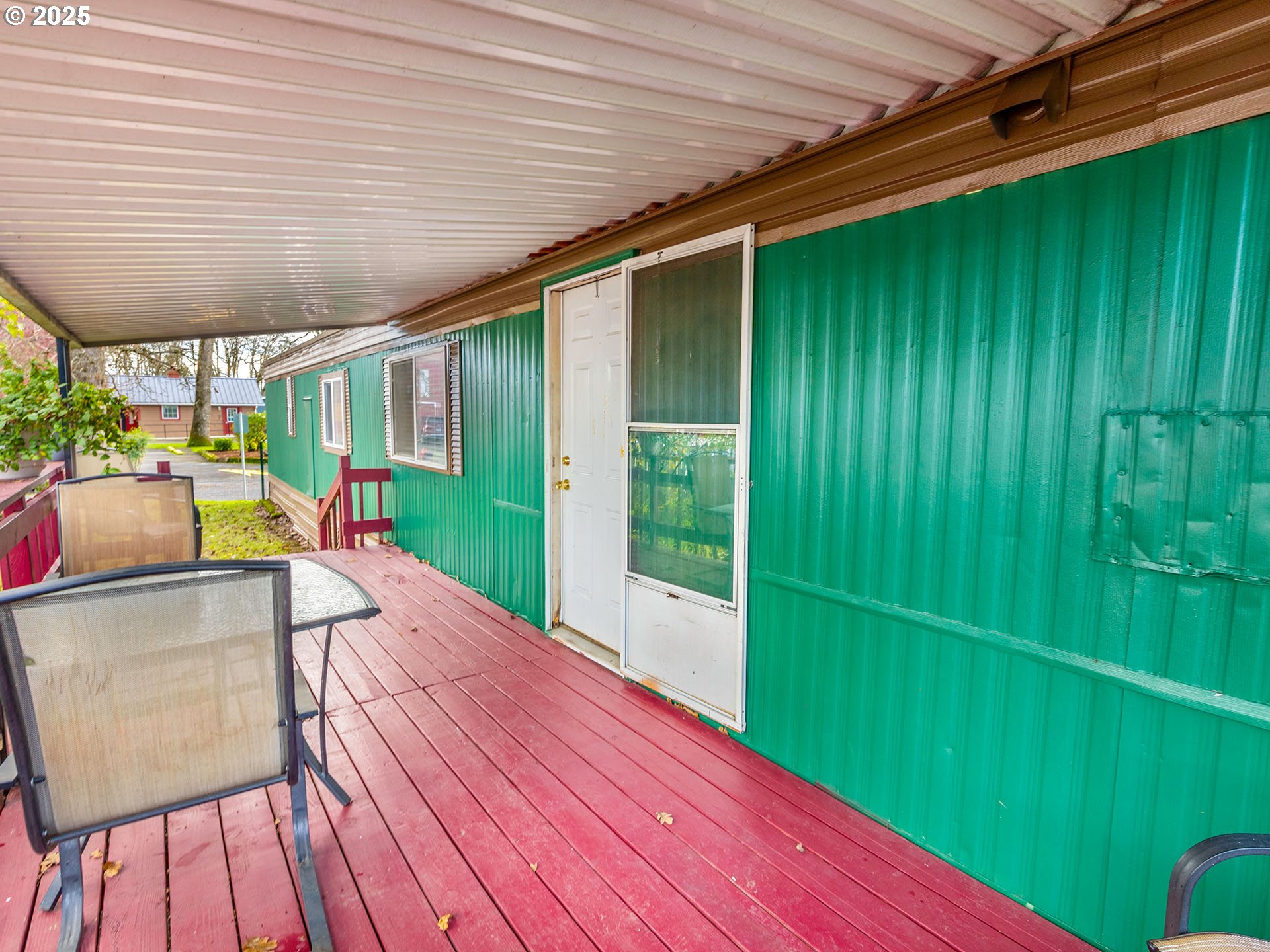 10701 Southeast Highway 212, Unit 13 Clackamas, OR 97015 - Photo 23 of 26 a view of a backyard with a patio