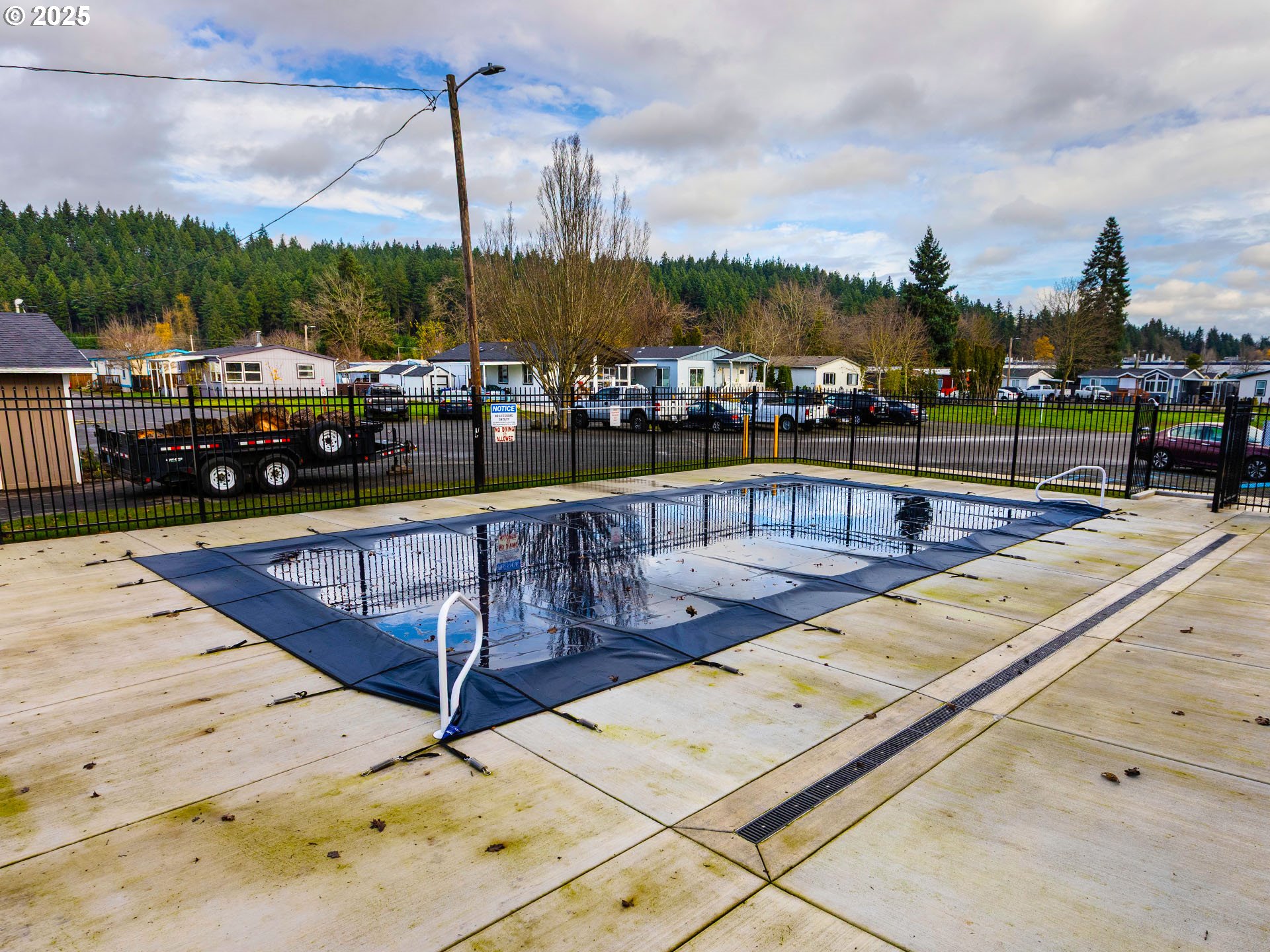 10701 Southeast Highway 212, Unit 13 Clackamas, OR 97015 - Photo 25 of 26 a view of swimming pool with outdoor seating and city view