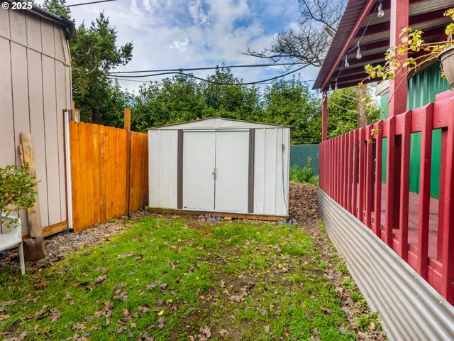 a view of a backyard with potted plants