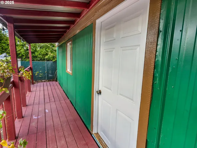 a view of balcony with wooden floor and outdoor space