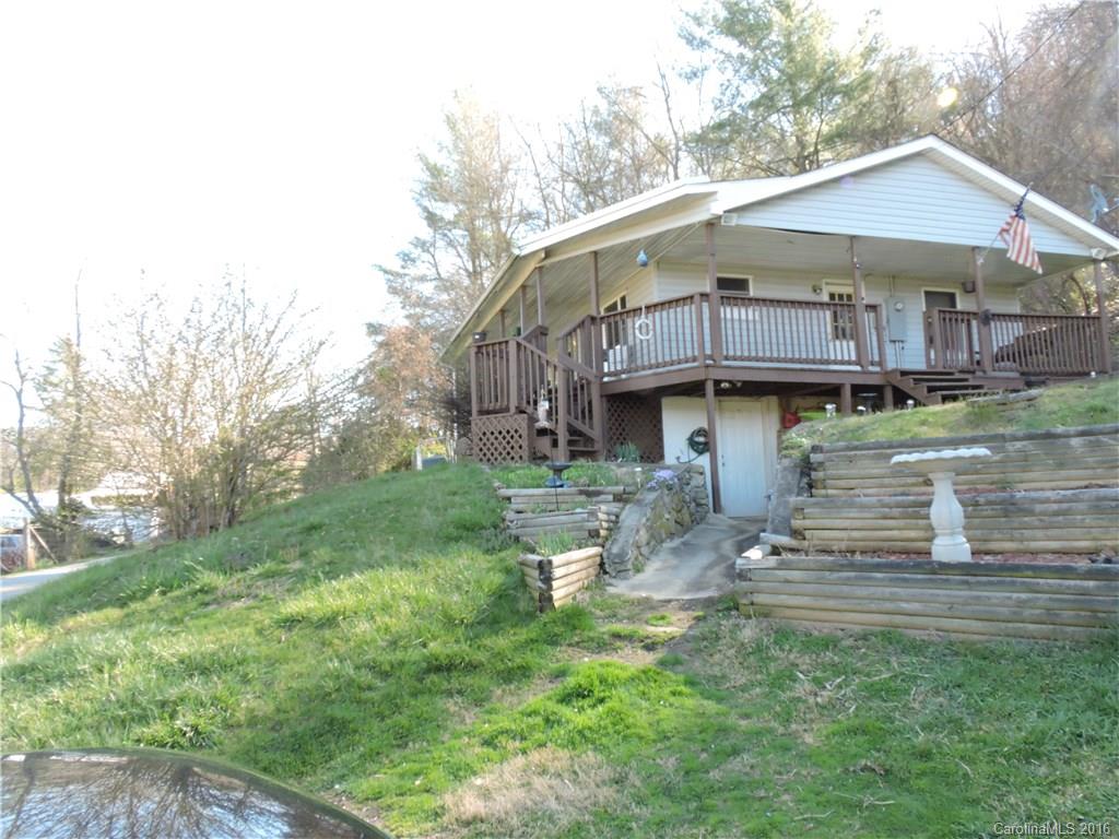 384 Scottdale Road Canton, NC 28716 - Photo 1 of 12 a view of a house with a yard