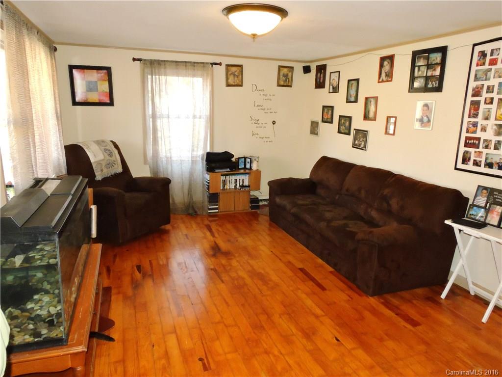 384 Scottdale Road Canton, NC 28716 - Photo 4 of 12 a living room with furniture and wooden floor