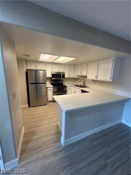 9070 Spring Mountain Road, Unit 210 Las Vegas, NV 89117 - Photo 4 of 12 This modern kitchen features sleek countertops and appliances, perfect for culinary endeavors.