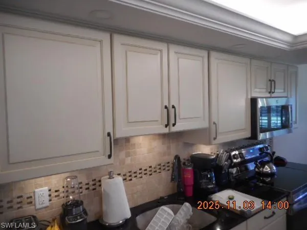 a kitchen with a cabinets and a stove
