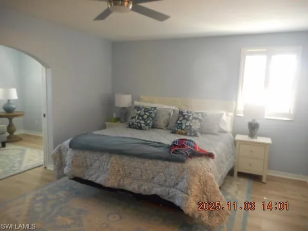 a bedroom with a bed and a table