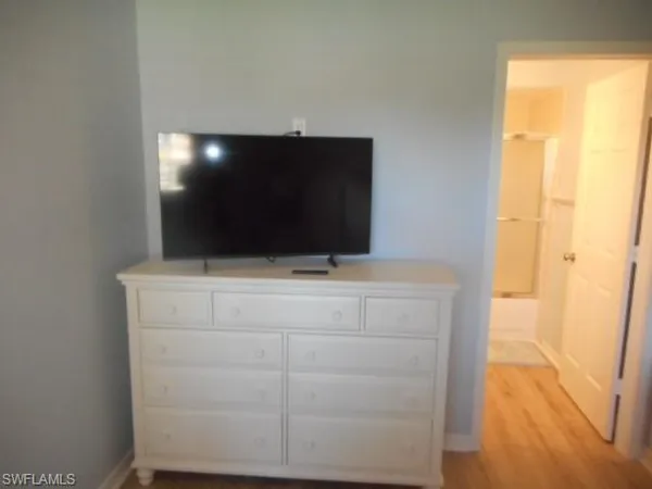 a kitchen with a sink cabinets and window