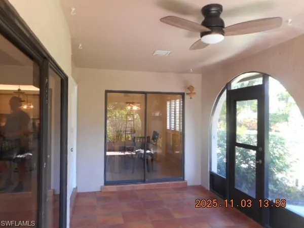 a view of a livingroom with a furniture and floor to ceiling window