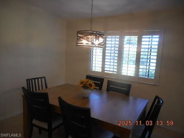a view of a dining room with furniture window and outside view