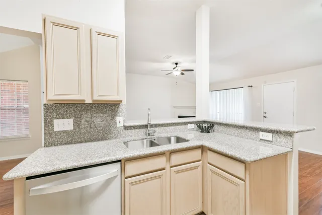 a kitchen with a sink and cabinets