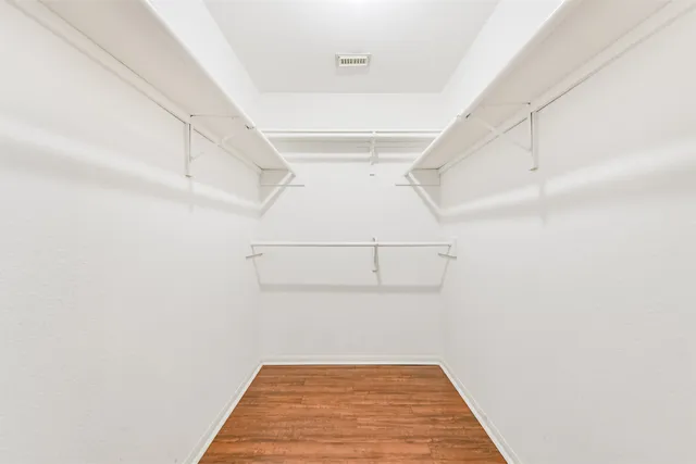 a view of a hallway with stairs