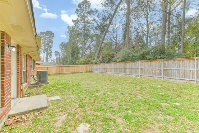 a view of backyard with green space