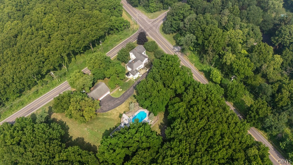 7942 Salt Springs Road Manlius, NY 13104 - Photo 4 of 50 This estate includes 2.5 acres, a 3 story detached barn, & a pool house with a wrap around deck that overlooks a luxurious inground pool!