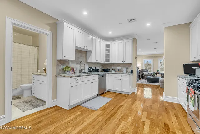 a large kitchen with a lot of counter space and appliances
