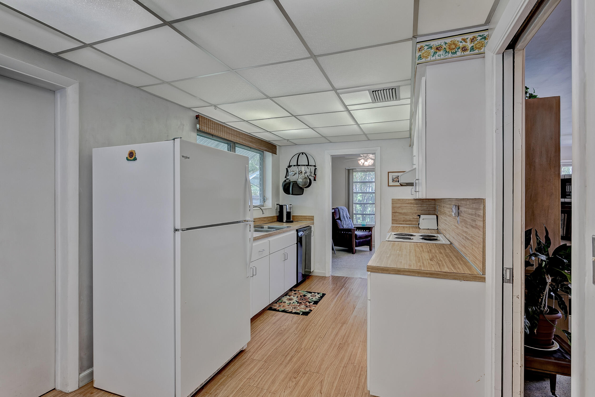 501 Inlet Road North Palm Beach, FL 33408 - Photo 17 of 58 a kitchen with a refrigerator a sink and cabinets