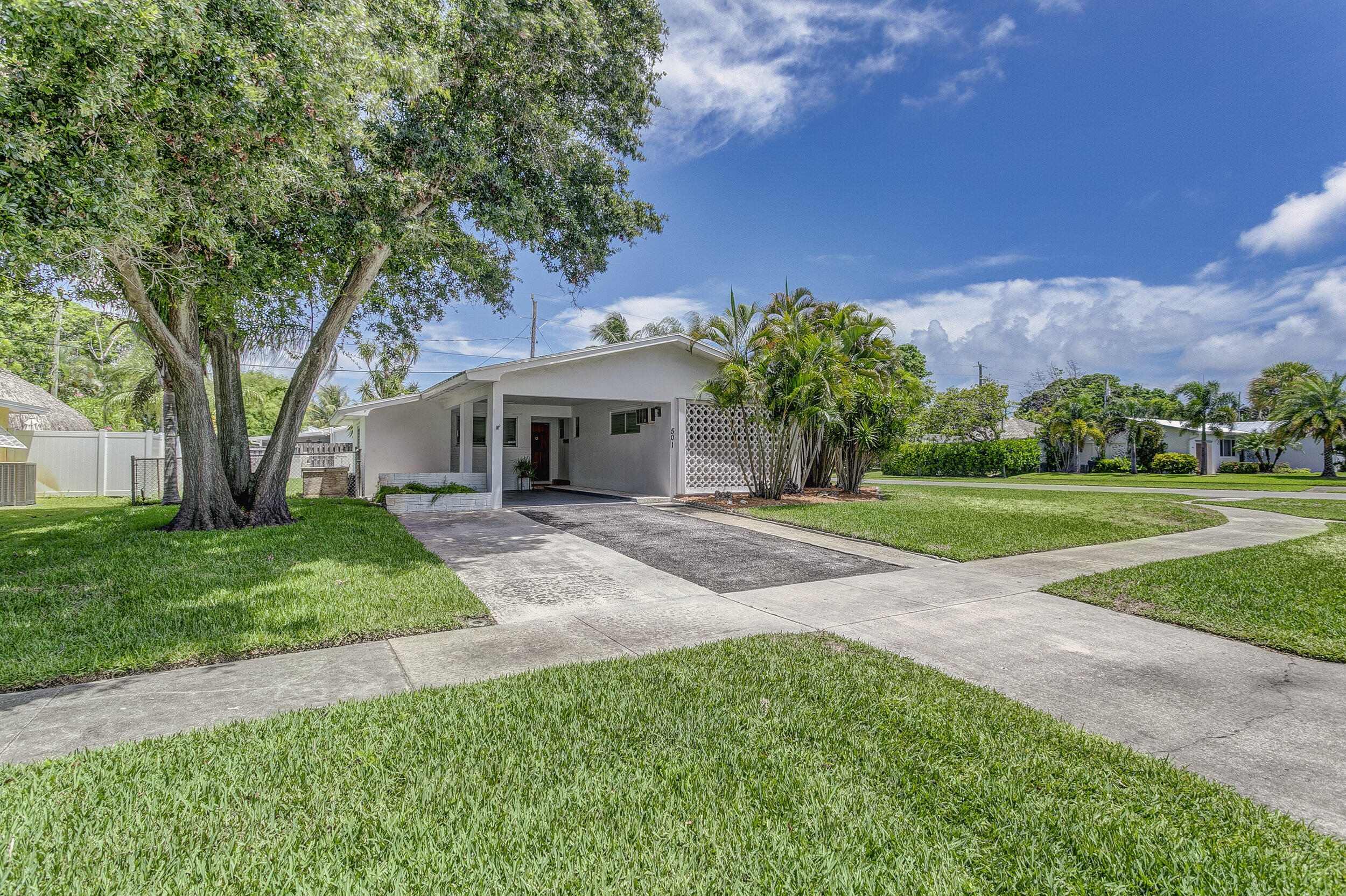 501 Inlet Road North Palm Beach, FL 33408 - Photo 2 of 58 a view of house with outdoor space and garden