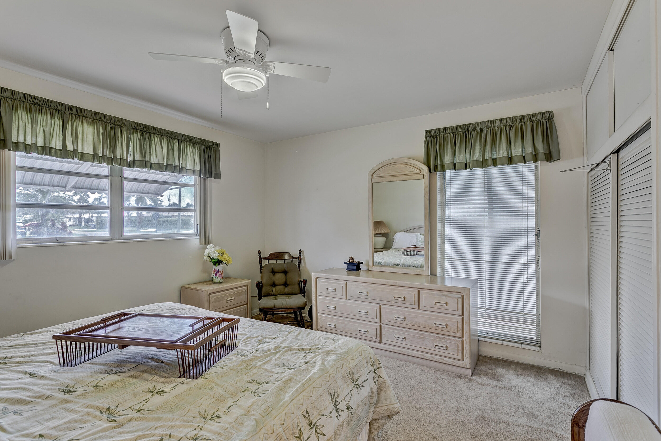 501 Inlet Road North Palm Beach, FL 33408 - Photo 24 of 58 a bedroom with a bed dresser and a window