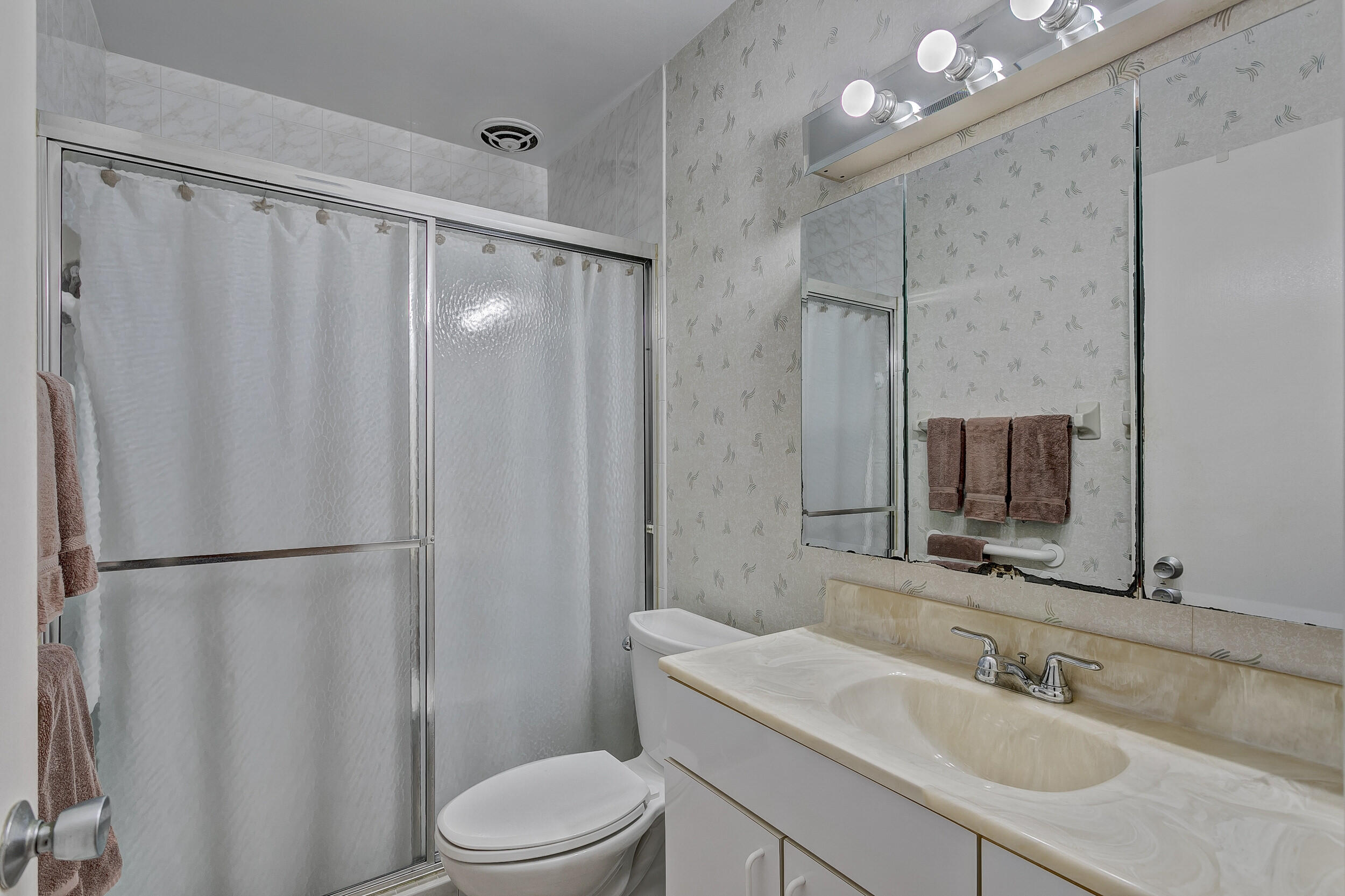 501 Inlet Road North Palm Beach, FL 33408 - Photo 26 of 58 a bathroom with a sink toilet and shower