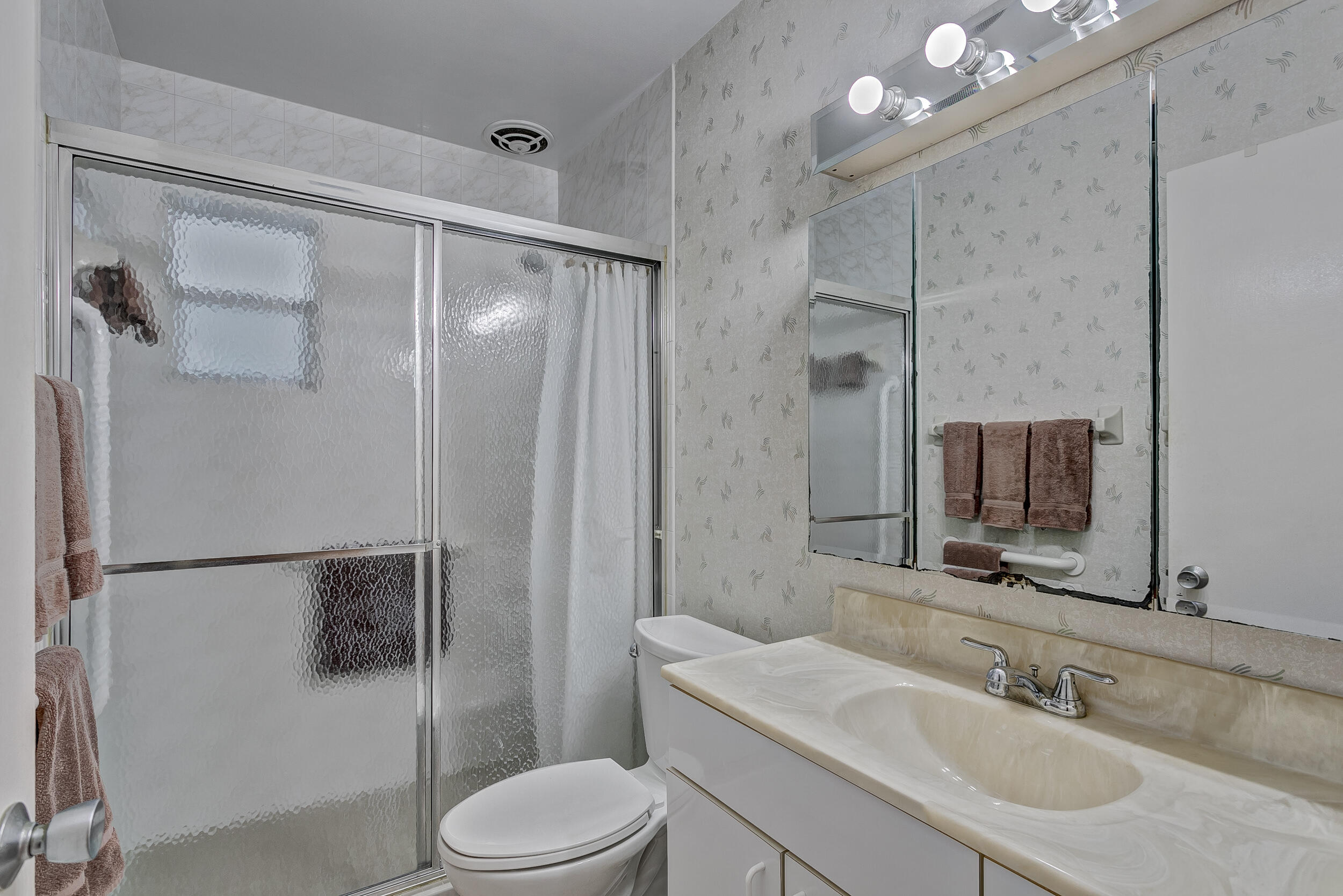 501 Inlet Road North Palm Beach, FL 33408 - Photo 27 of 58 a bathroom with a sink toilet and shower