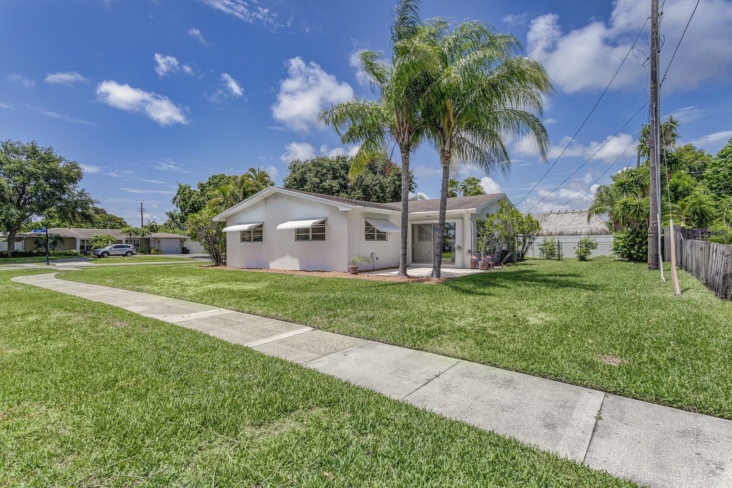501 Inlet Road North Palm Beach, FL 33408 - Photo 37 of 58 a front view of house with yard and green space