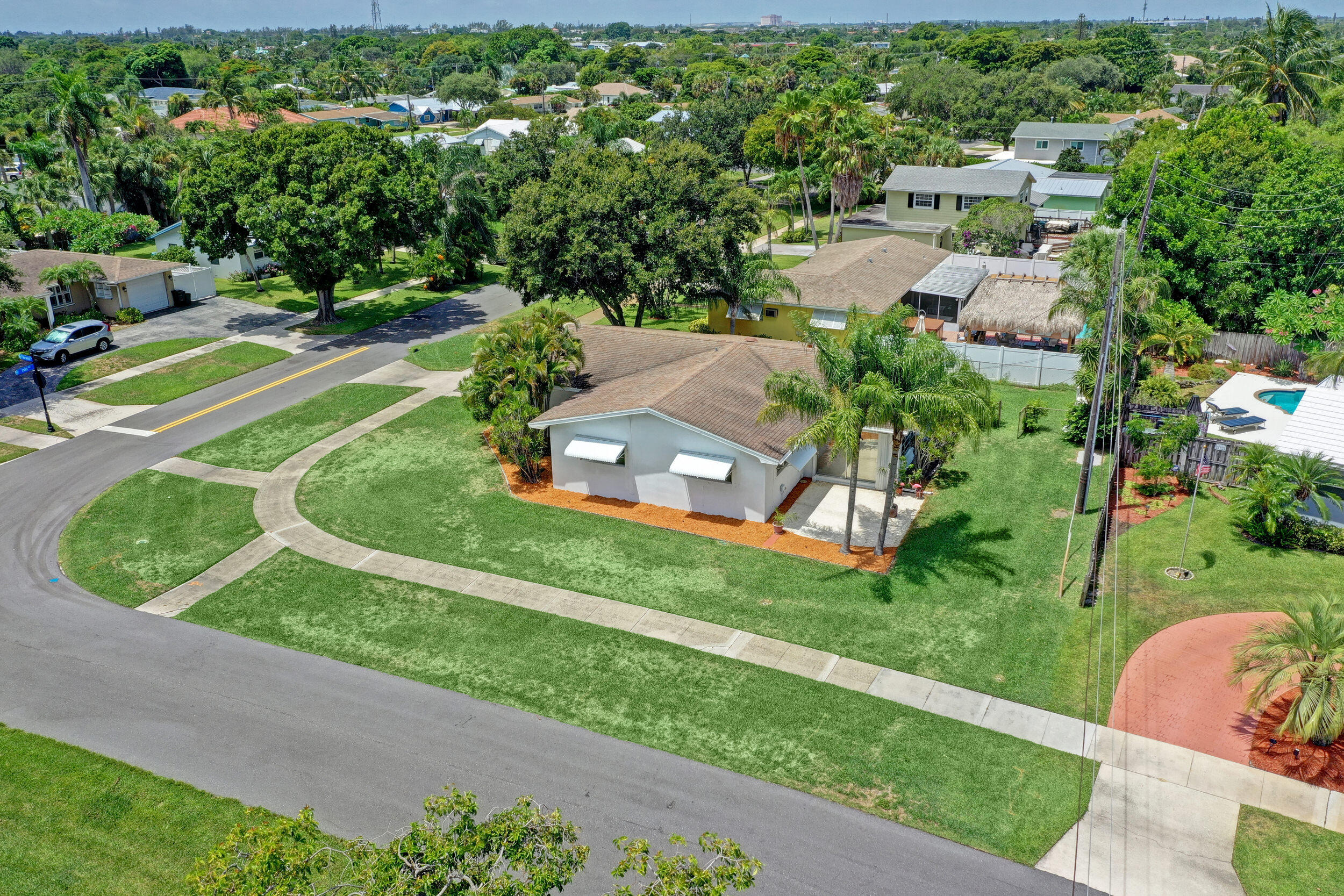 501 Inlet Road North Palm Beach, FL 33408 - Photo 48 of 58 an aerial view of a house with a garden and trees