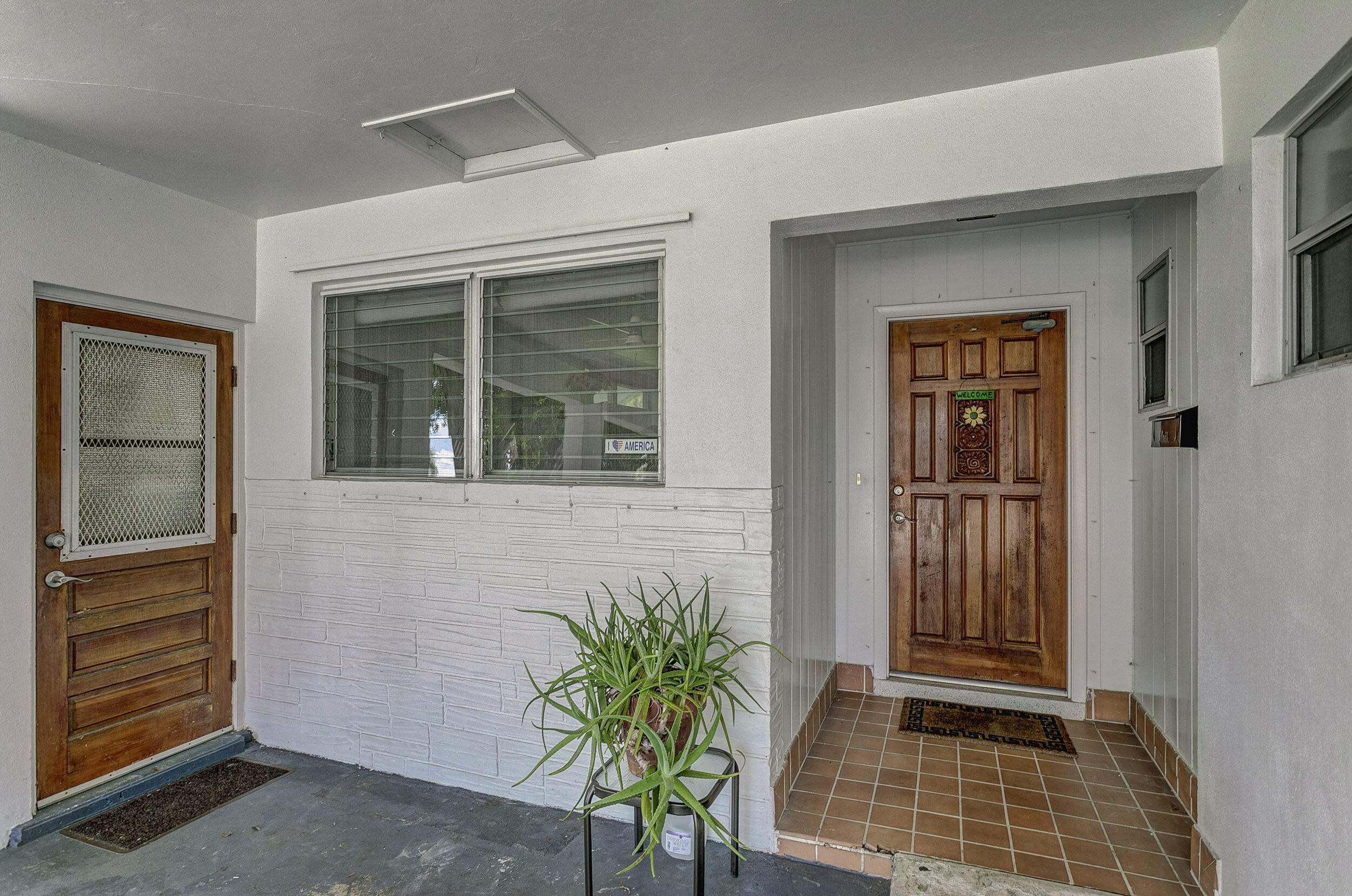 501 Inlet Road North Palm Beach, FL 33408 - Photo 6 of 58 a potted plant in front of a house