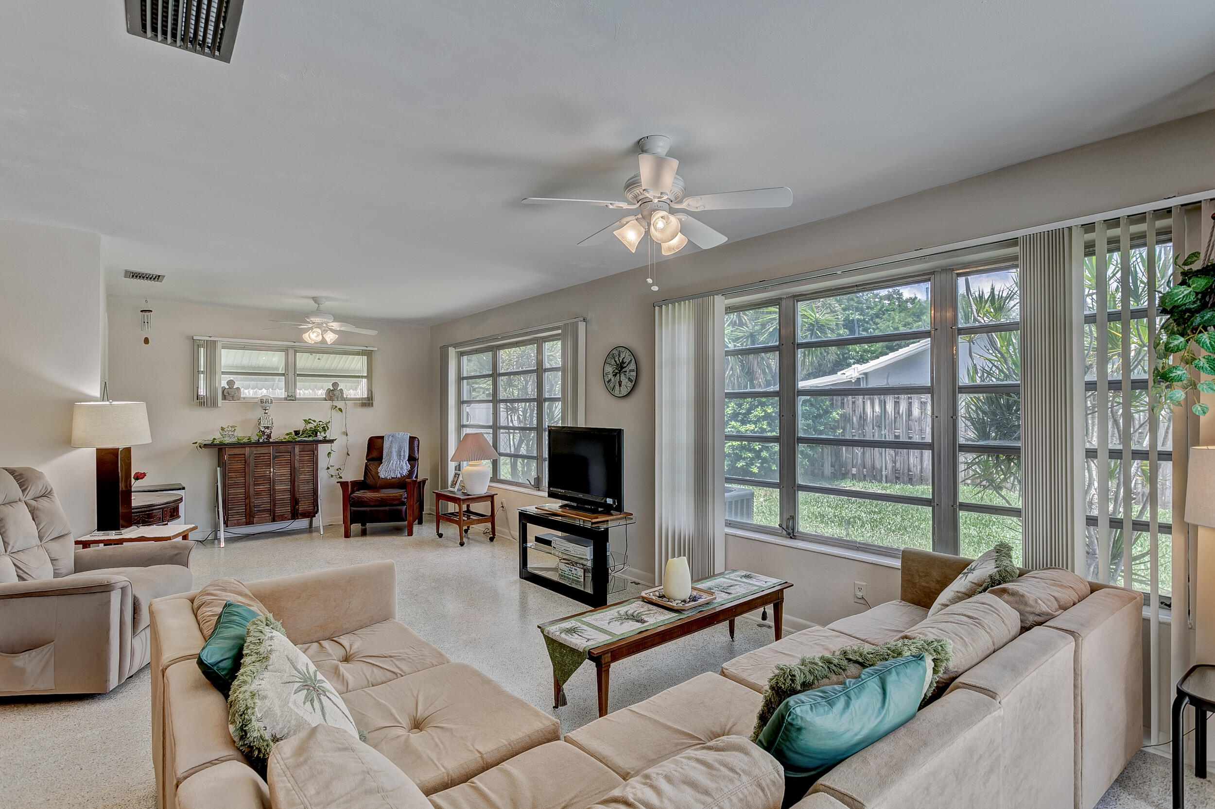501 Inlet Road North Palm Beach, FL 33408 - Photo 9 of 58 a living room with furniture large window and flat screen tv