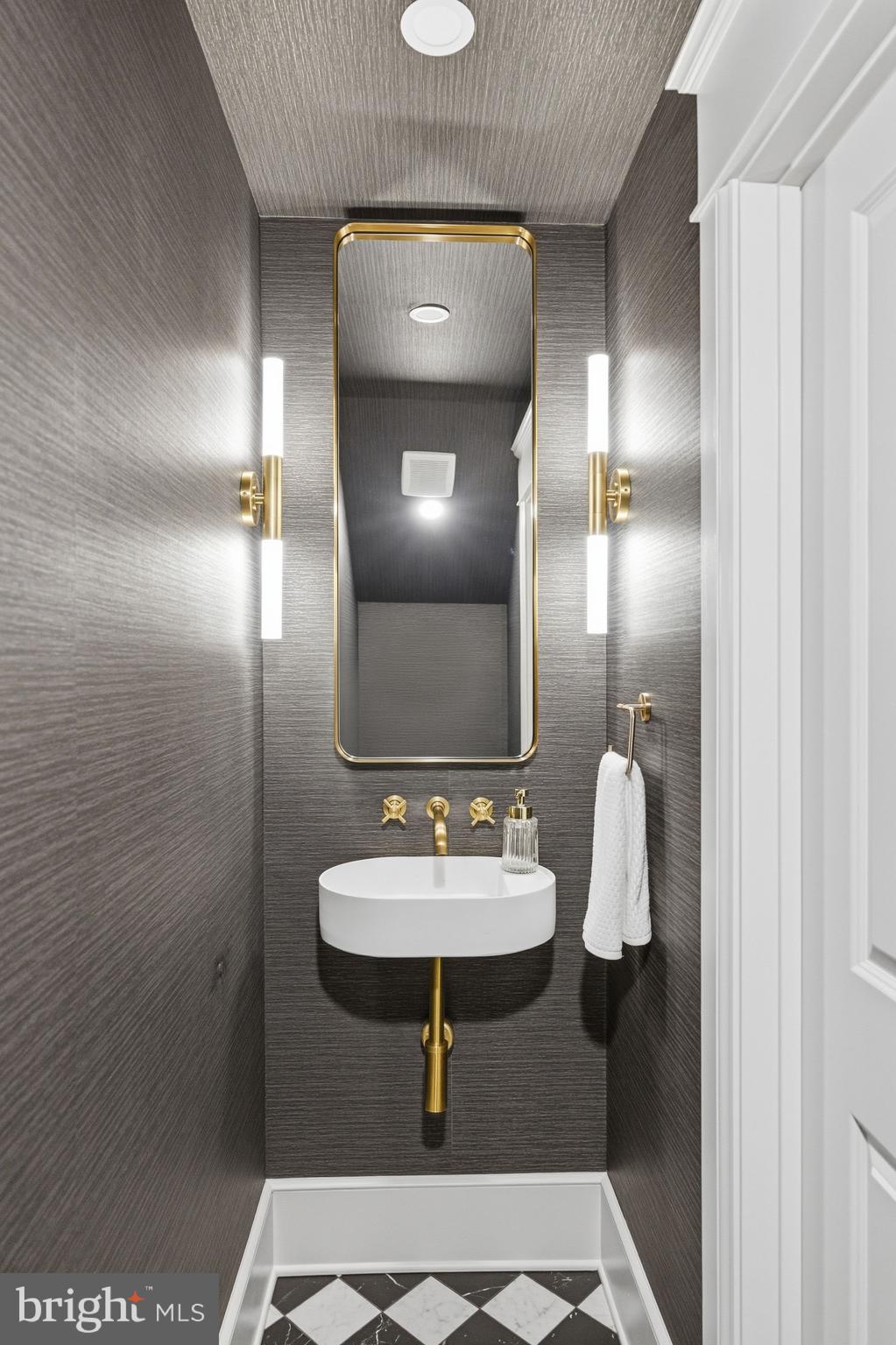 1816 Belmont Road Northwest Washington, DC 20009 - Photo 18 of 62 a bathroom with a sink and a mirror