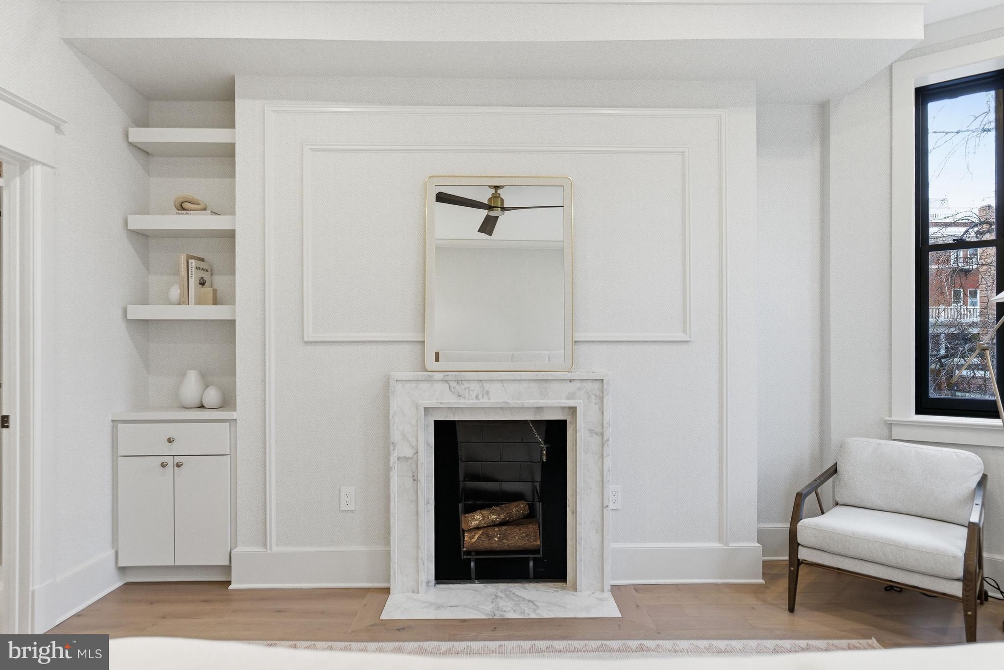 1816 Belmont Road Northwest Washington, DC 20009 - Photo 24 of 62 a living room with furniture and a fireplace