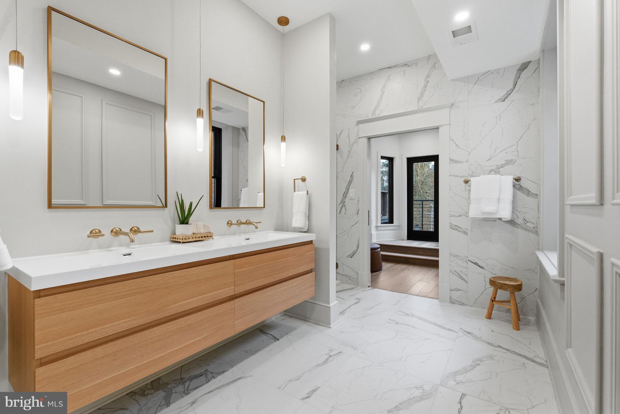 1816 Belmont Road Northwest Washington, DC 20009 - Photo 27 of 62 a bathroom with a double vanity sink mirror and double