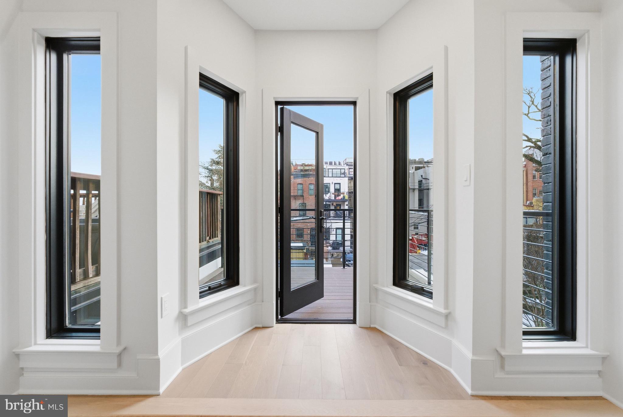1816 Belmont Road Northwest Washington, DC 20009 - Photo 31 of 62 a view of a hallway with windows
