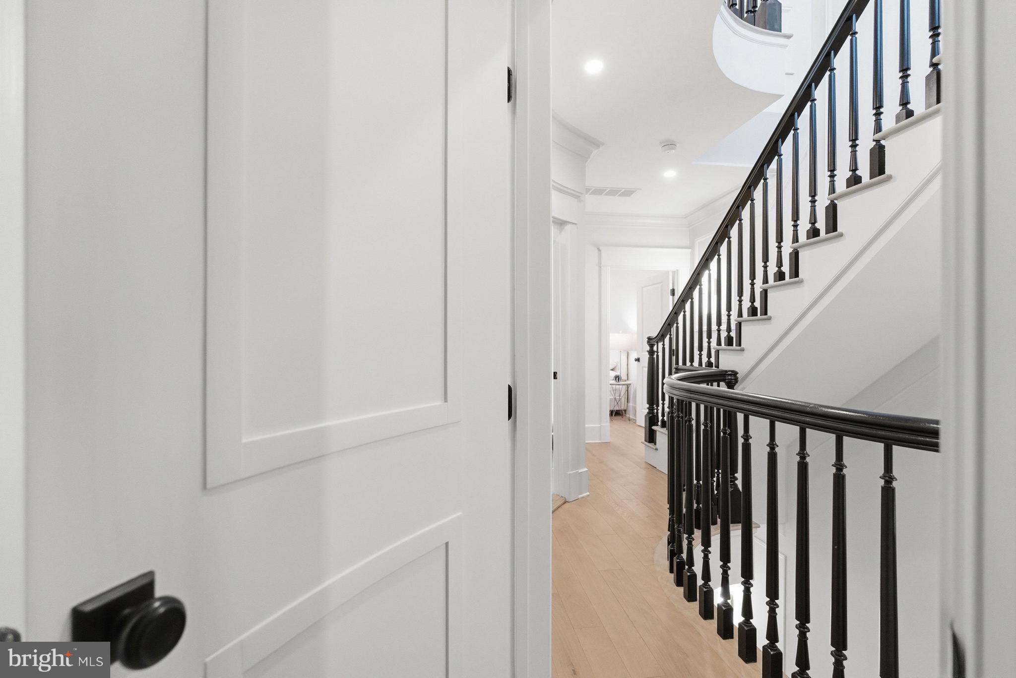 1816 Belmont Road Northwest Washington, DC 20009 - Photo 32 of 62 a view of staircase with railing and white walls