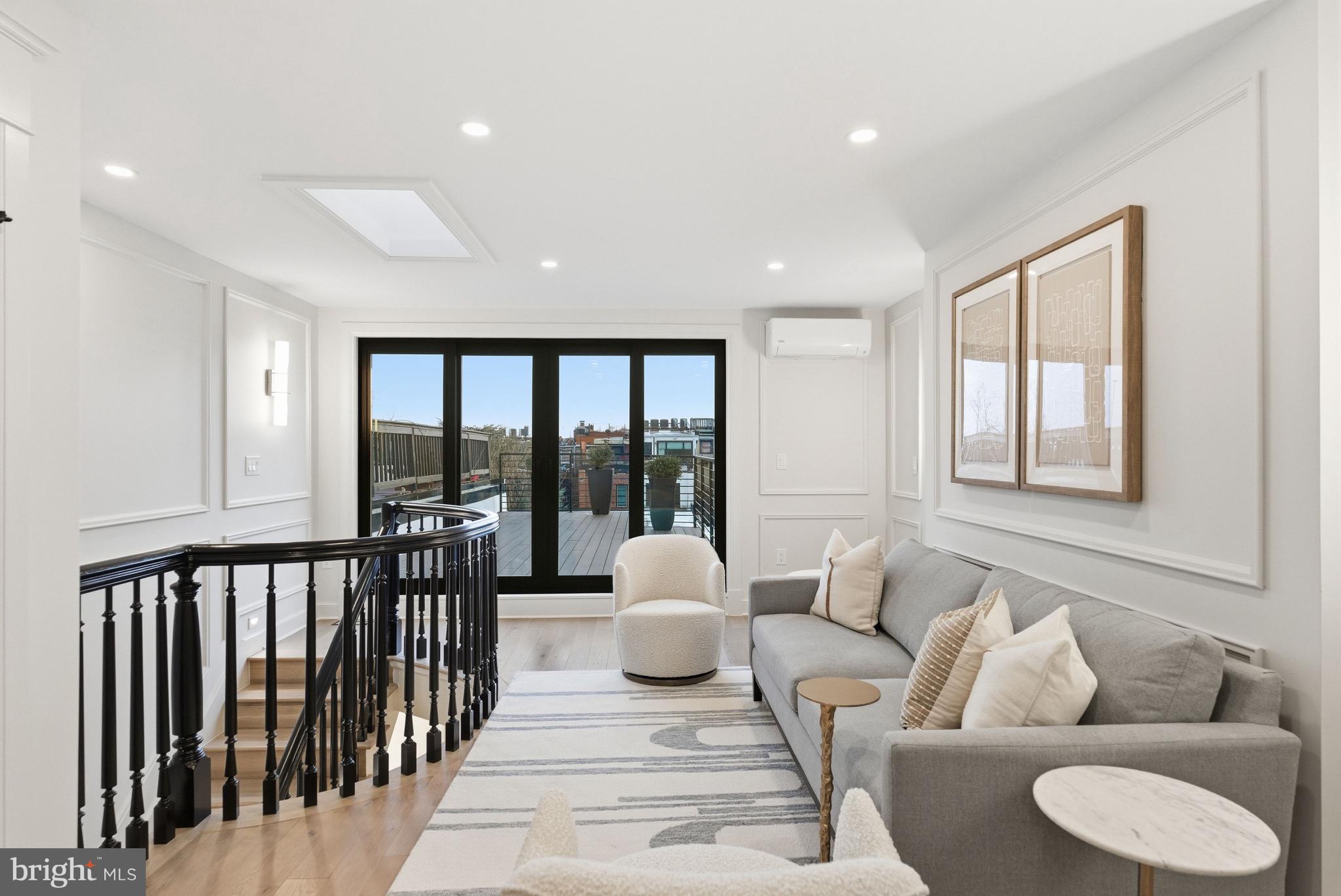 1816 Belmont Road Northwest Washington, DC 20009 - Photo 44 of 62 a living room with furniture and a large window