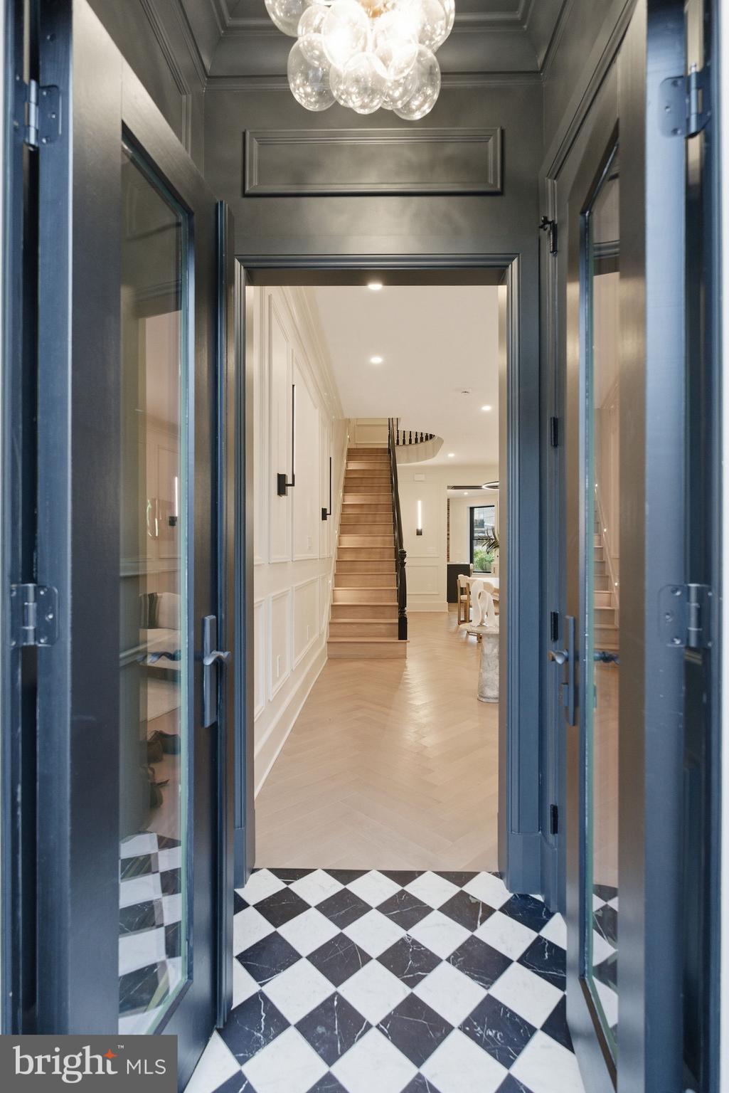 1816 Belmont Road Northwest Washington, DC 20009 - Photo 5 of 62 a view of a hallway with a black and white checkered floor