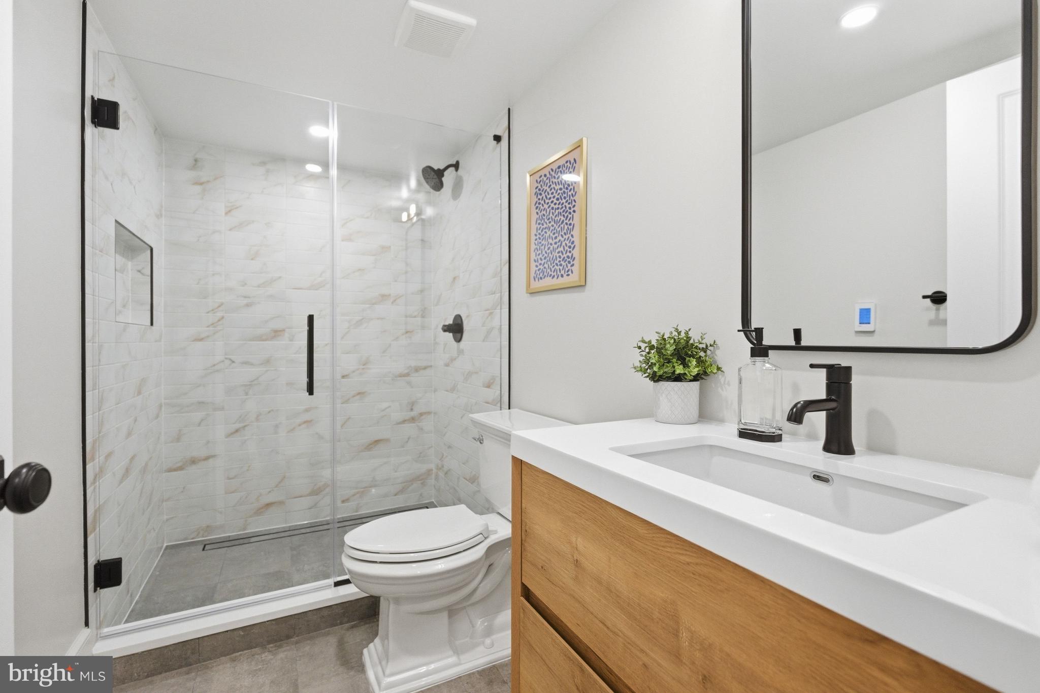 1816 Belmont Road Northwest Washington, DC 20009 - Photo 59 of 62 a bathroom with a sink a toilet and shower