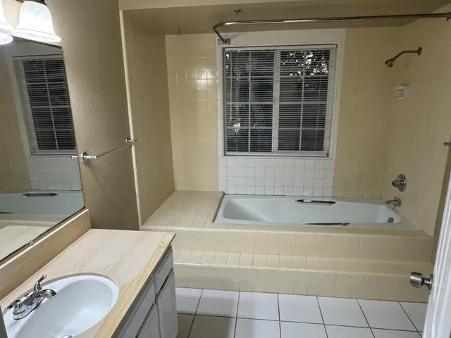 a bathroom with a sink and a bathtub