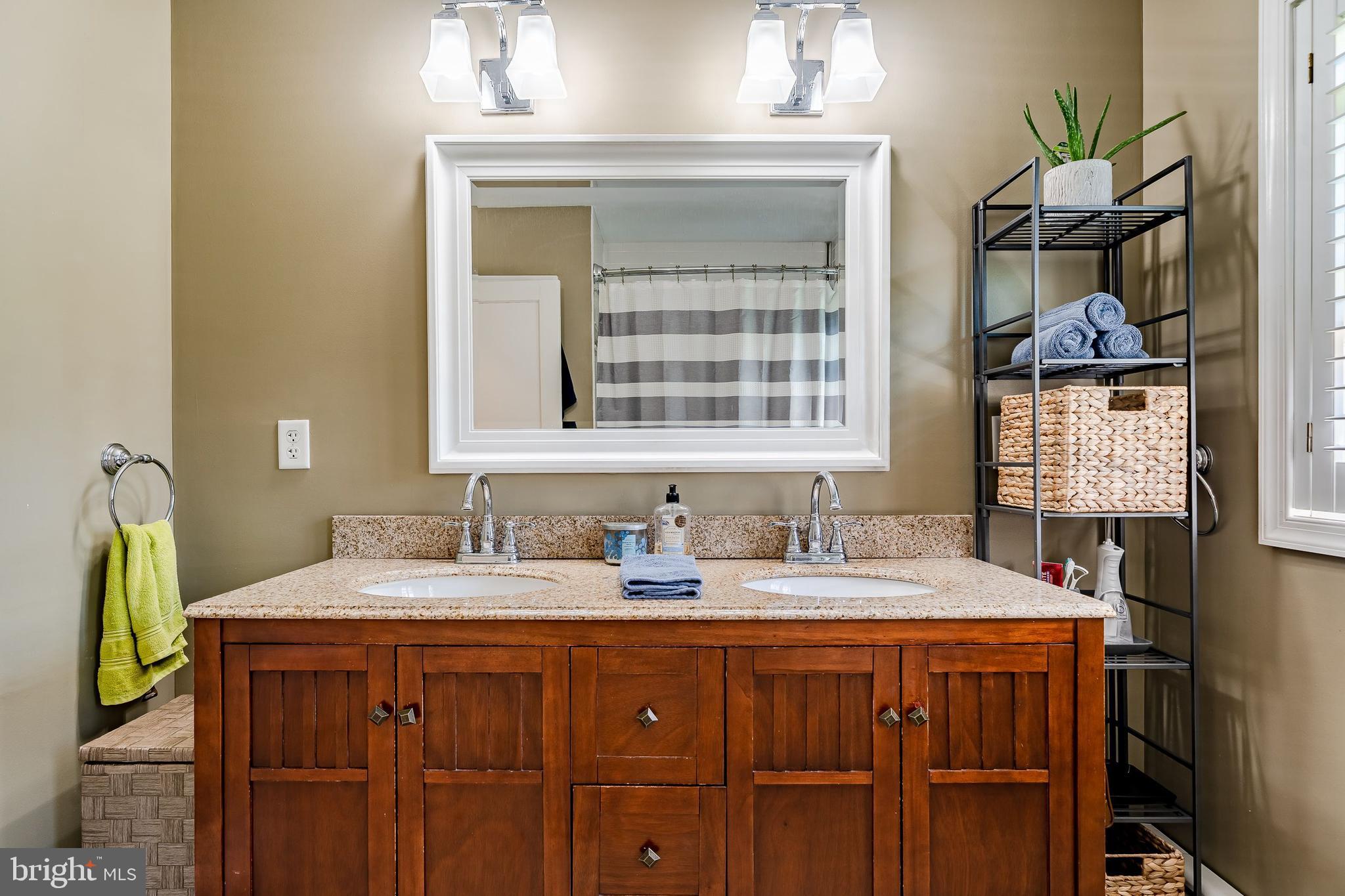 1538 Carmac Road West Chester, PA 19382 - Photo 12 of 33 a bathroom with a sink a vanity and a mirror